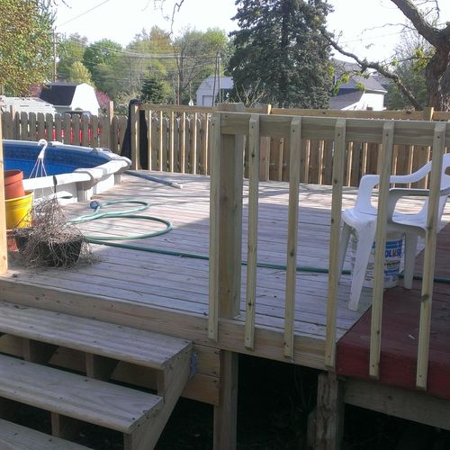 Deck add-on around above-ground swimming pool