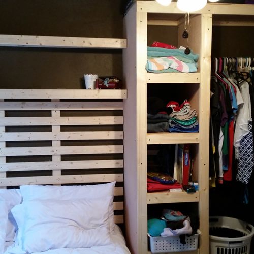 Bedroom setup with "built-in" style closet and she