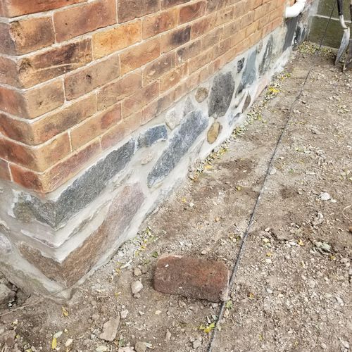 Foundation stone tuck pointing