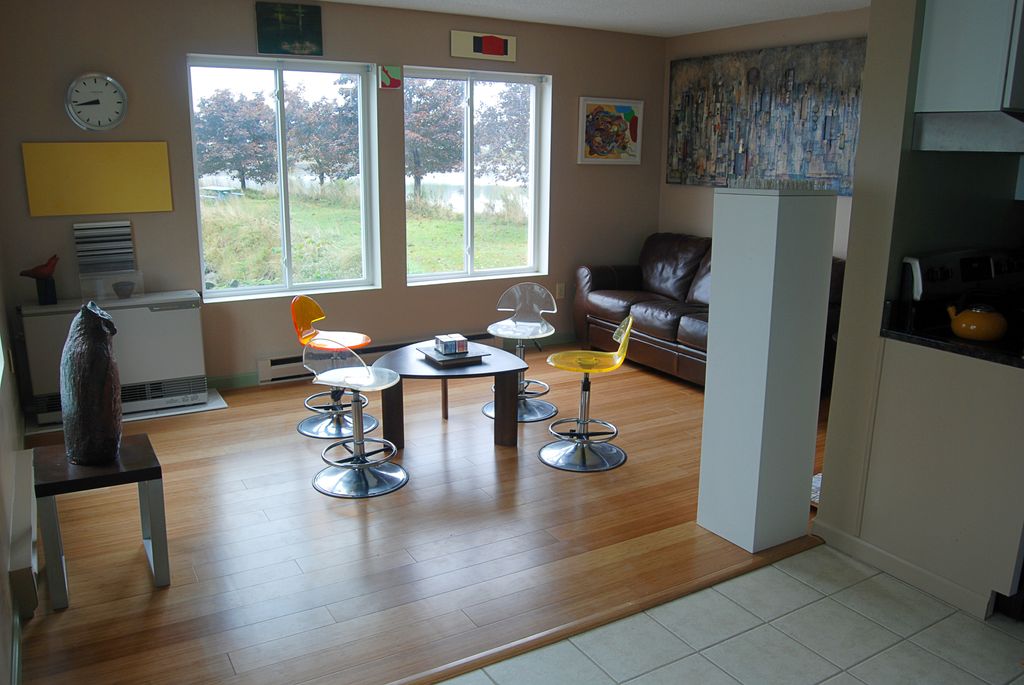 Vertical bamboo flooring and ceramic tile work in 