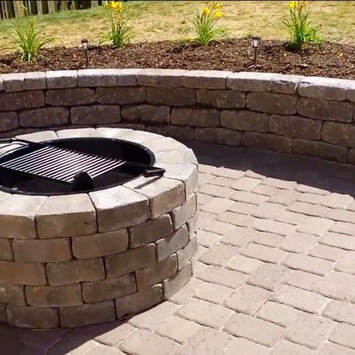 Seating wall, paver patio, fire pit and plant inst
