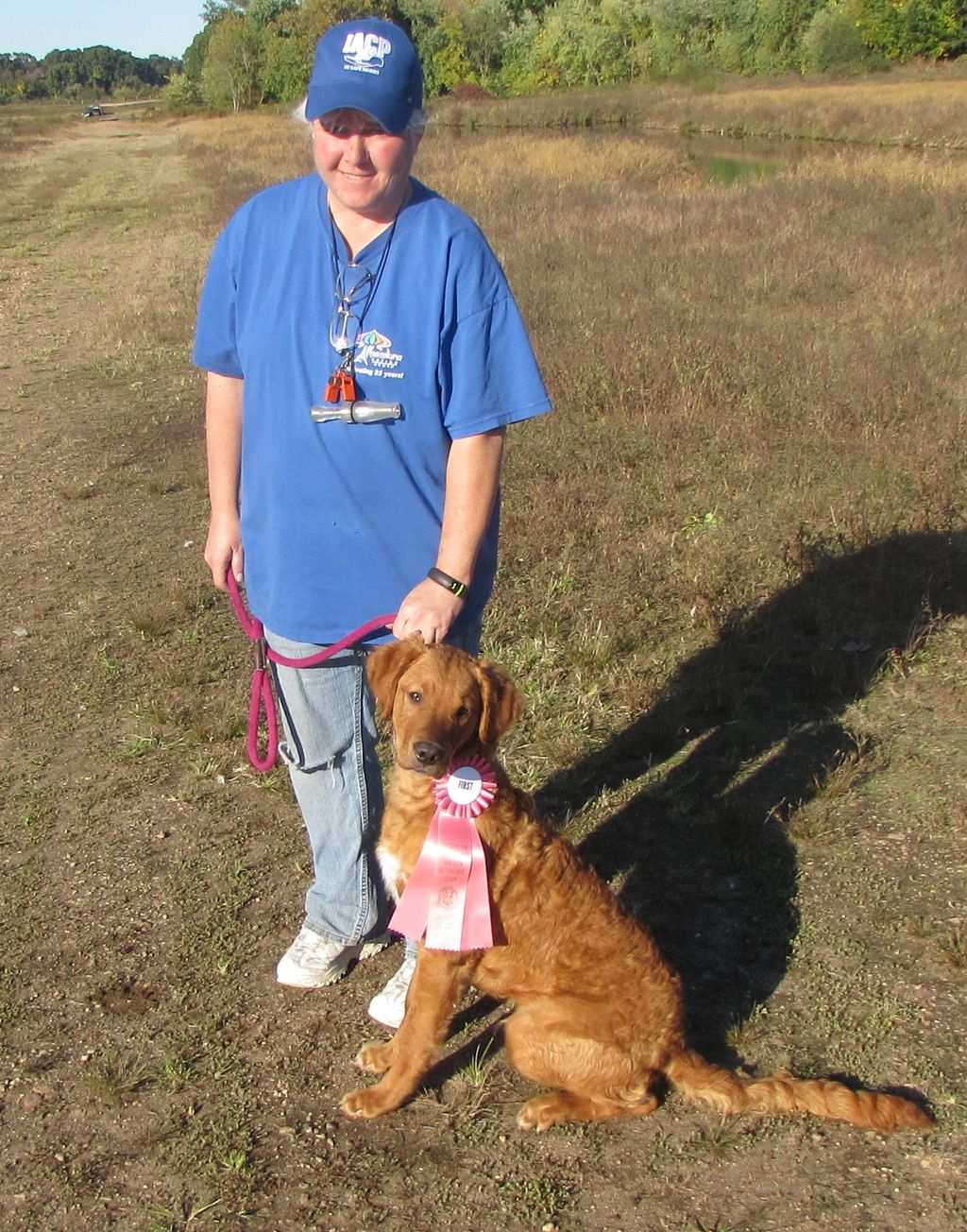 Steel, 6 months old, with his first place ribbon f