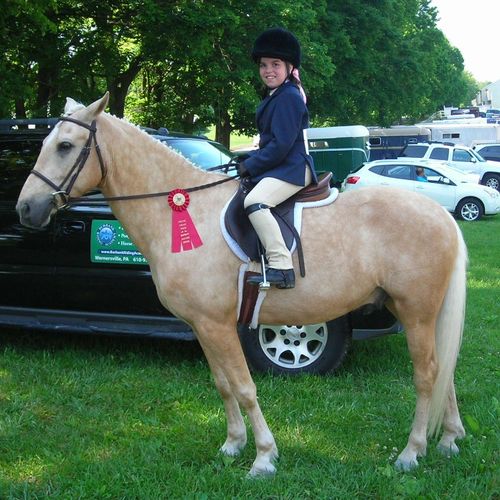A student proud of her pony!