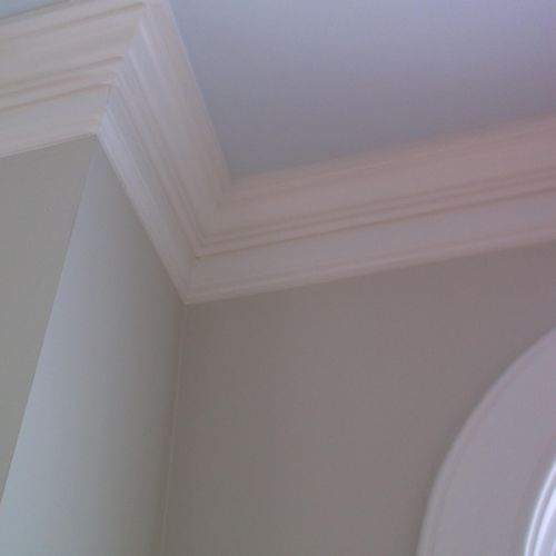 Close up of wall, crown molding and trim.
