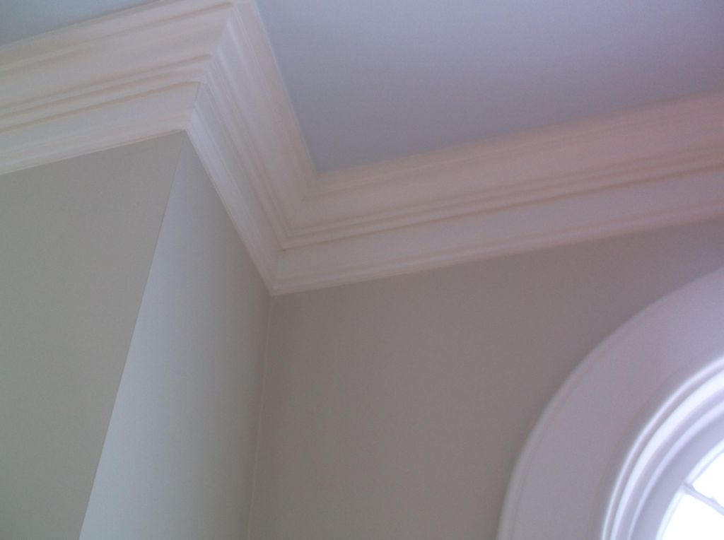 Close up of wall, crown molding and trim.