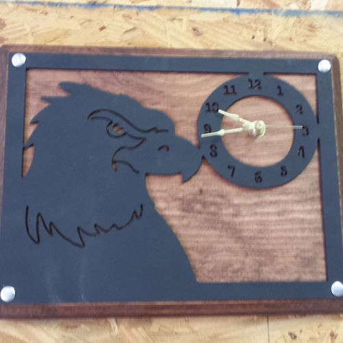 Artistic clocks and metal cut-outs