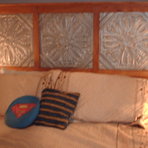 Headboard. Client wanted tin tiles incorporated in