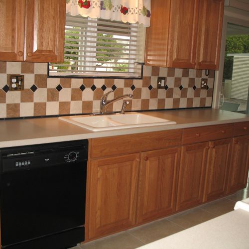 Kitchen cabinets and tile backsplash