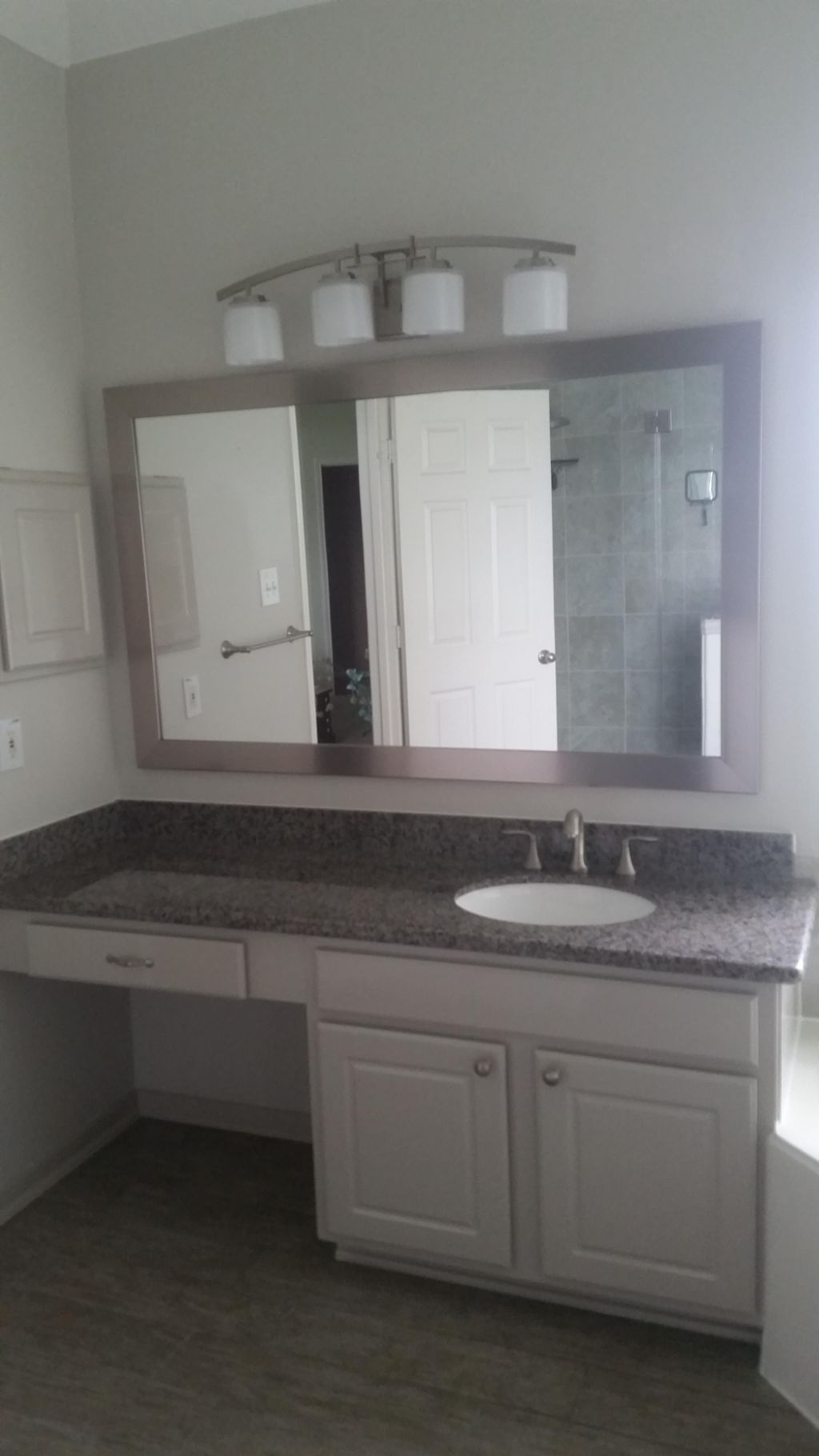 Granite vanity top, framed mirror, brush nickel pl