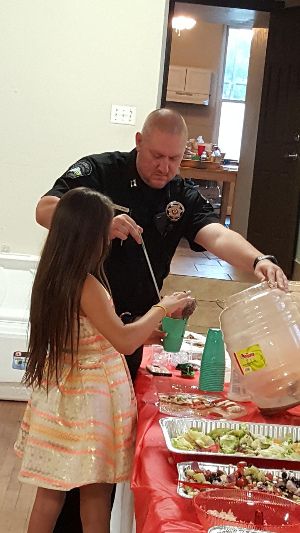 Cpt. J. Karnes helping out at sweet 16 party.