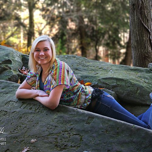 Madi lounging on a rock formation in Mill Creek pa