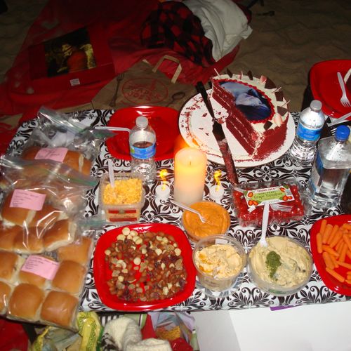 Food spread for beach birthday celebration.  Food 
