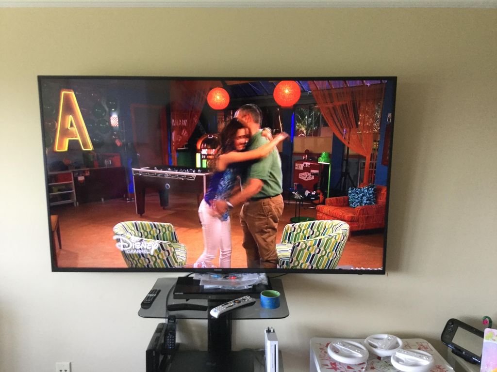 TV installation with shelf