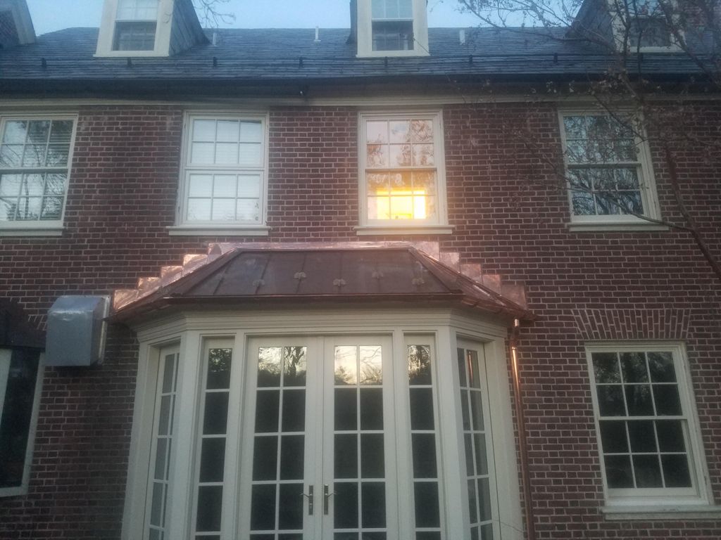 New standing seam copper roof, copper gutter and c