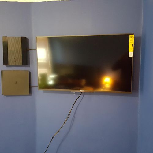 50" LCD TV Mounted. Playstation Systems w/ Control