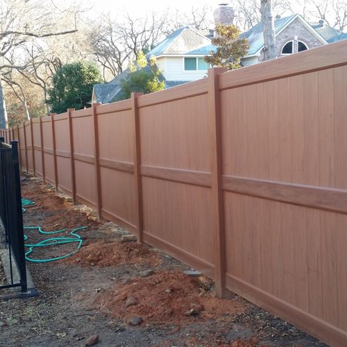 Removed wooden fence and installed vinyl fence in 