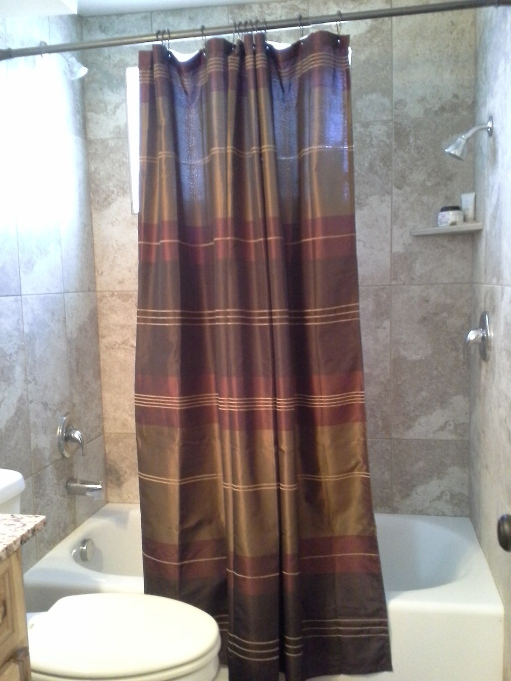 Double headed shower with added height to one side