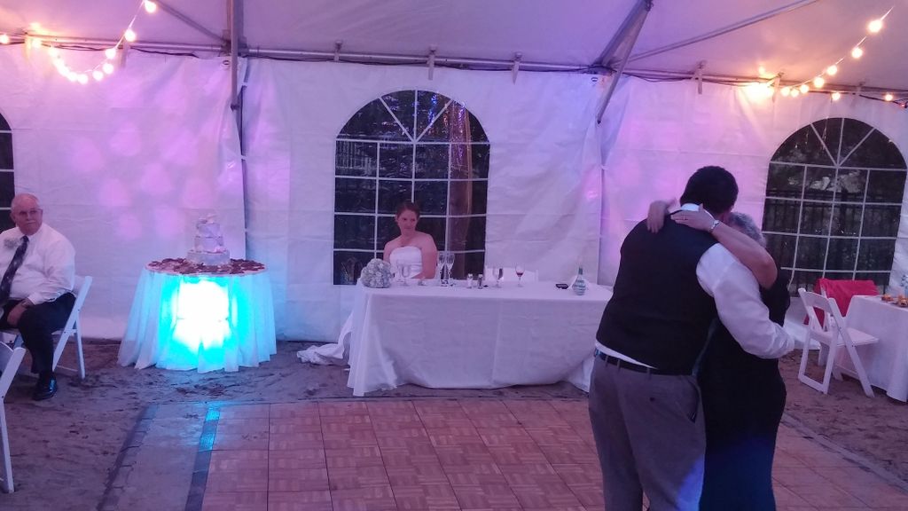 Cake table underlighting with wall GOBO hearts.