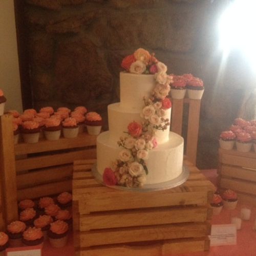 Cupcakes and a tiered cake!  Cute wine crates for 