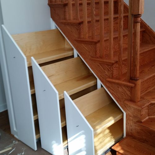 Stair's with custom 36" deep pull out bookshelves