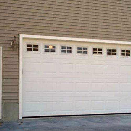A new 16'x7' Steel insulated door with glass top s