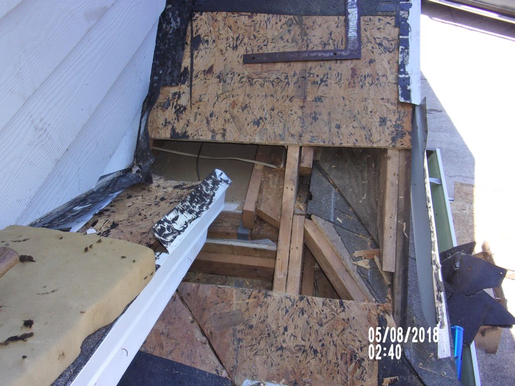 ROOF LEAKING DAMAGED SHEATHING REMOVED DURING