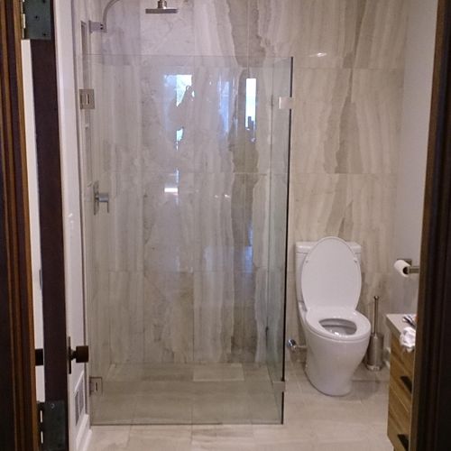 Handicap-accessible custom tile shower.