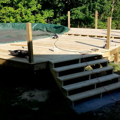 Stairs built, posts on, flooring going on
