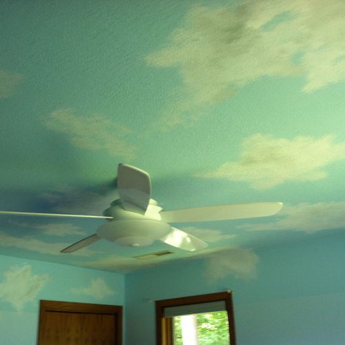 Clouds in a young girl's room adds a perfect touch