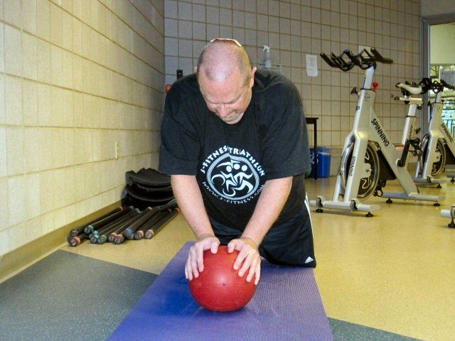 Coach Ken demonstrating the Ball Pushup.