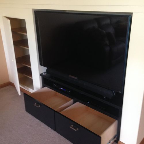 TV installation in an alcove and custom built draw