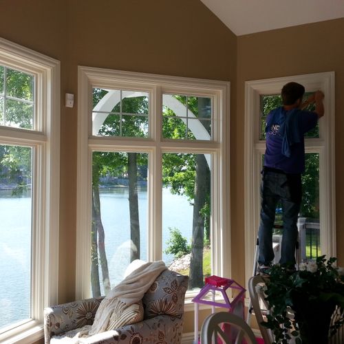 Installing window film at customer's lake house