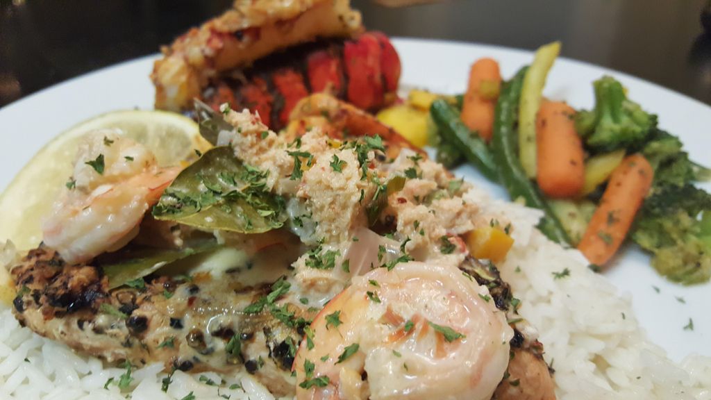 Grilled Salmon served with a Cream Wine Sauce, ove