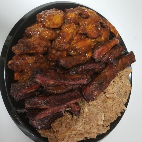Sample platter of ribs, wings and pull pork.