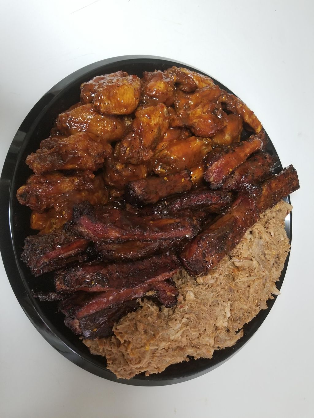 Sample platter of ribs, wings and pull pork.