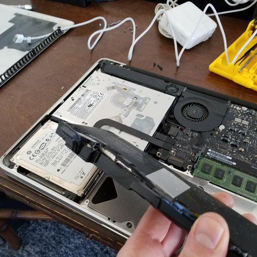 Exploded battery from a customers' MacBook Pro. St