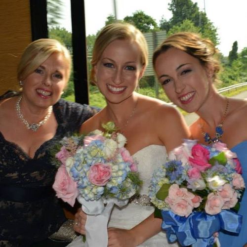 A happy bride with Mom and Sis.