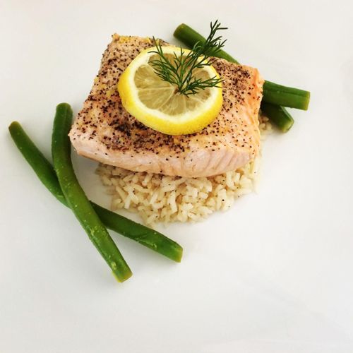 Poached Salmon In White Wine Served Over Rice Pila