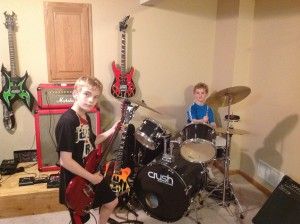 My two boys who love playing the guitar and drums.