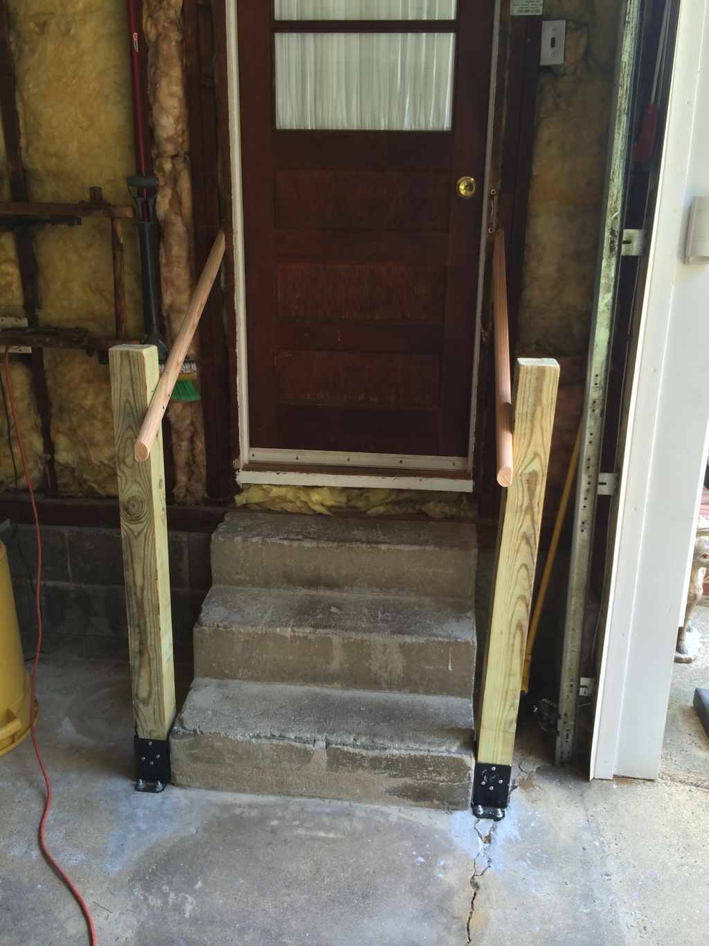 installed handrail set and mounted to cement floor