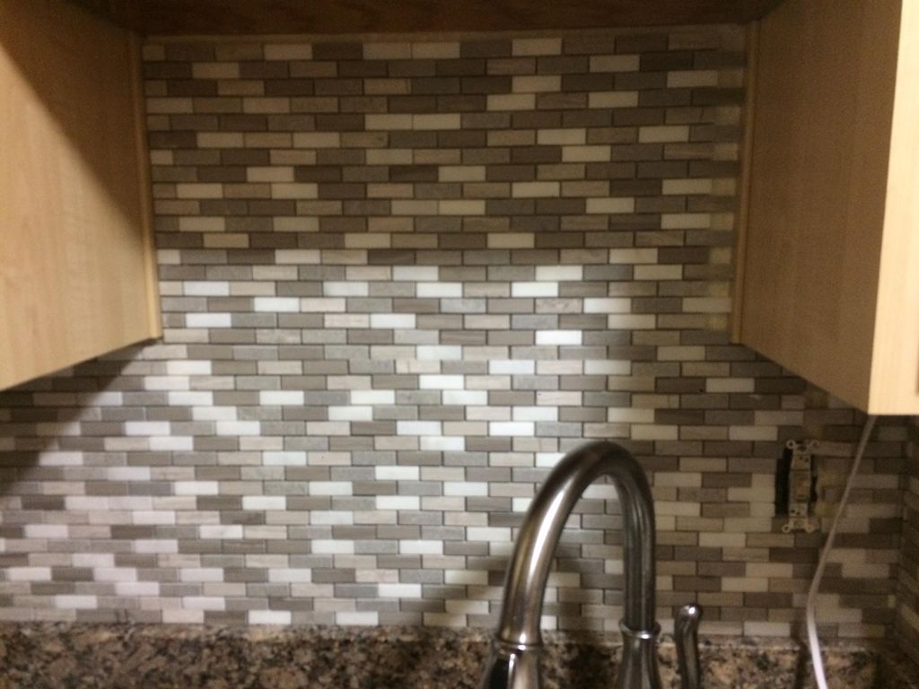 Helped a friend add a granite backsplash to liven 
