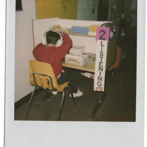 An elementary student working on listening.