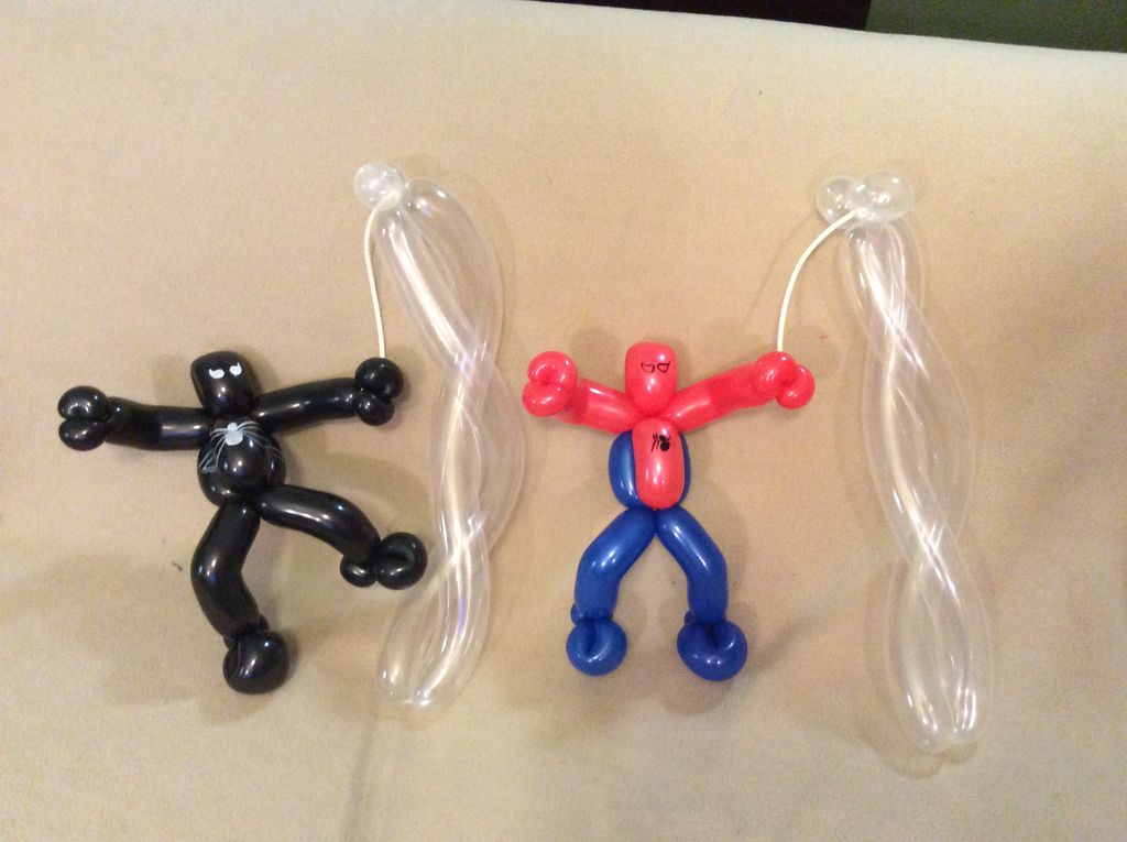 Spiderman and Venom swining from webs This would b