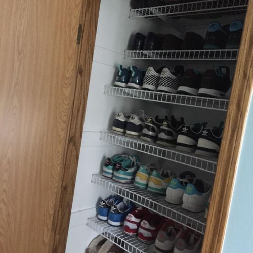 Linen closet converted to shoe storage for this sh