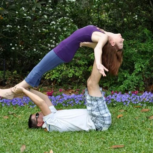 My husband and I practicing acro-yoga.