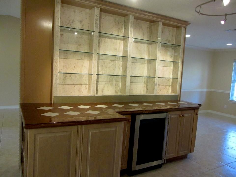 Custom built and finished in maple, marble and gla