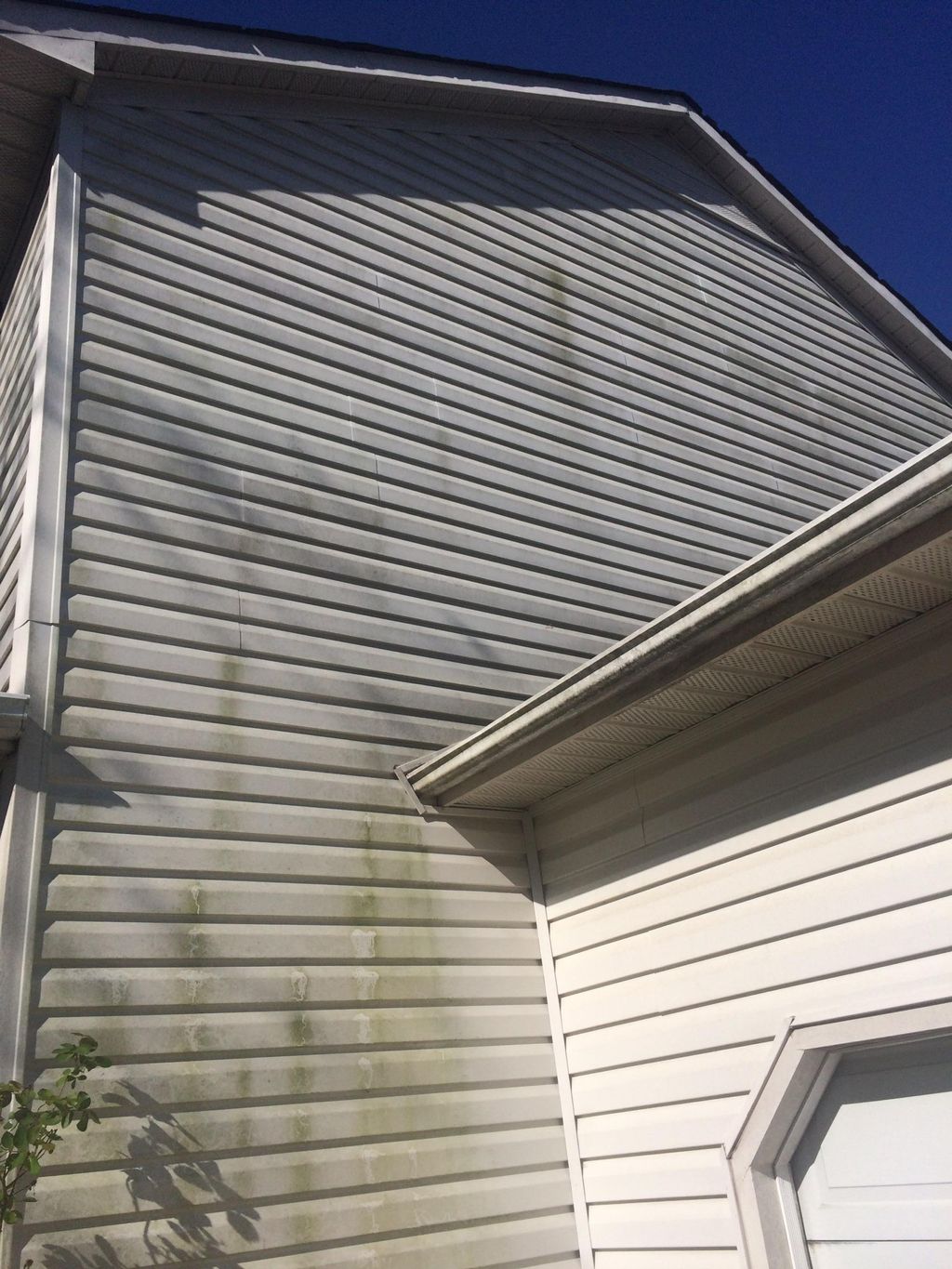 Mold and mildew on a two story home, Before washin