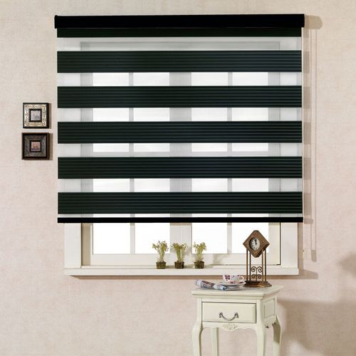 A black and white zebra blind installed on the out