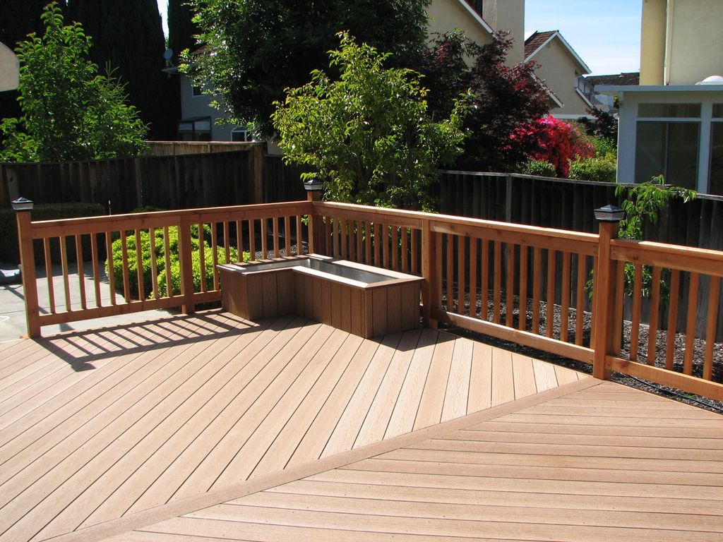Composite decking with redwood railings and custom