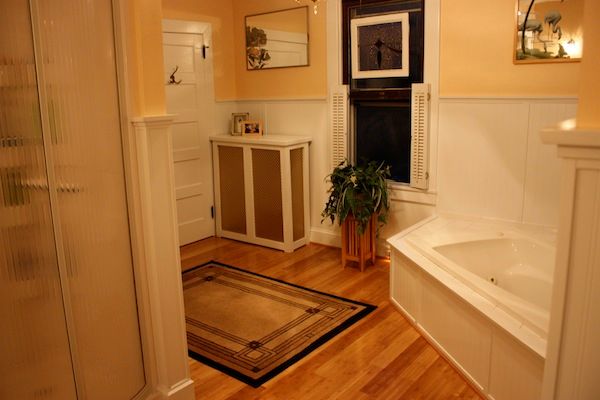 Peach Walls over White Wainscoting in a Large Bath